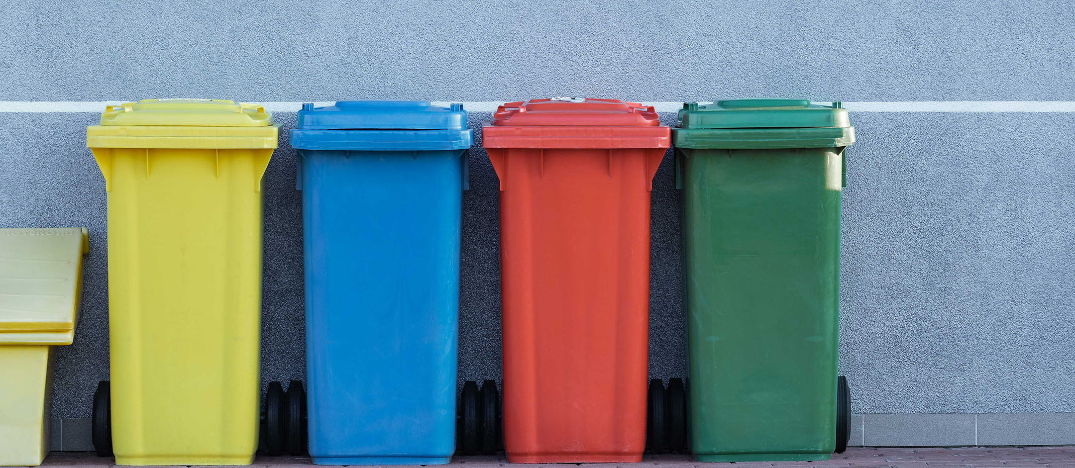 Four assorted-color trash bins