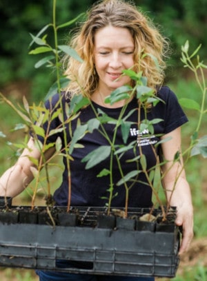 Woman holding plants