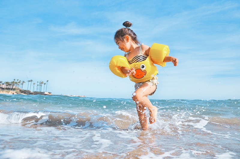 Girl Playing on Beach