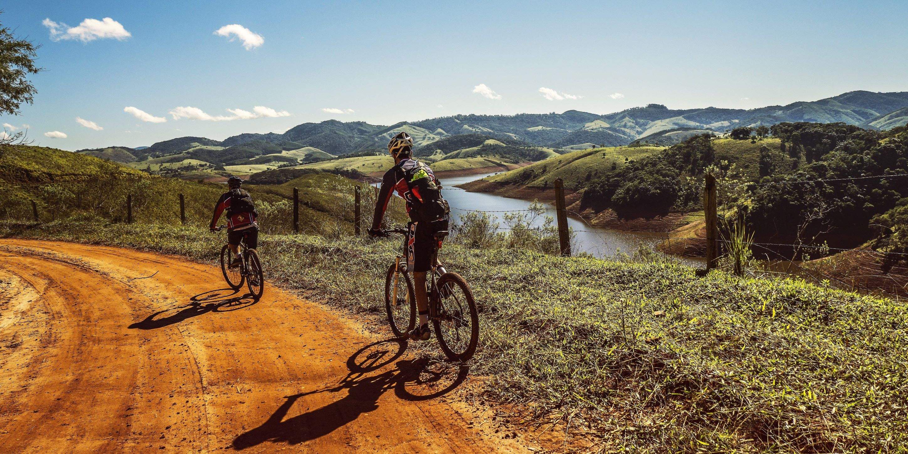 two men on a mountain riding bikes