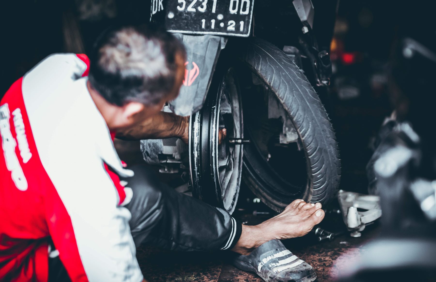man fixing bike