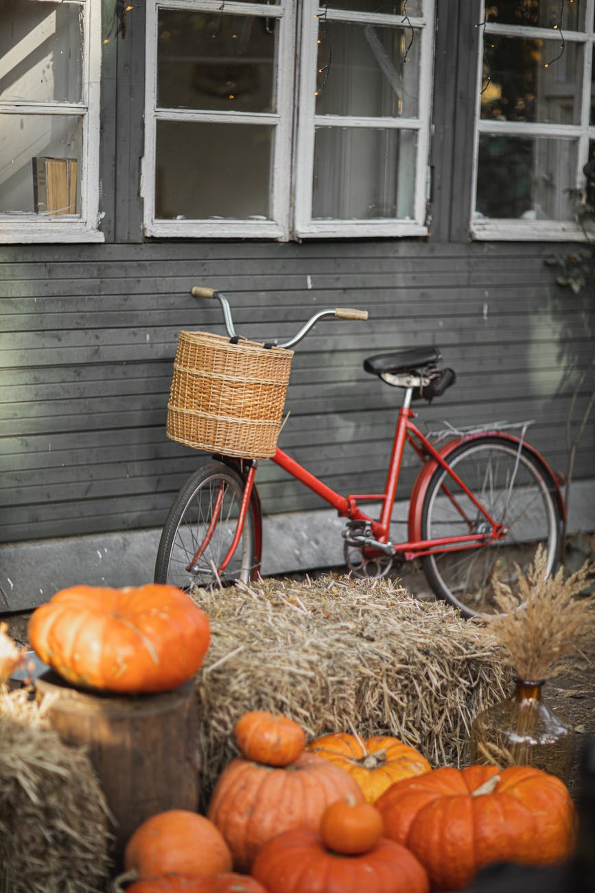 Red Bike in front of Gray House