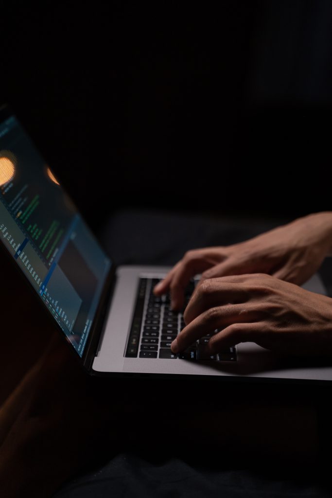 Person Using Silver and Black Laptop Computer.