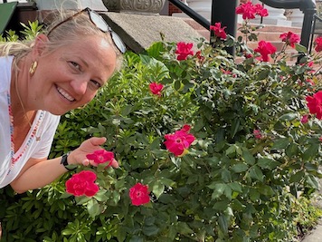 Ann Summers standing in front of her flower garden3
