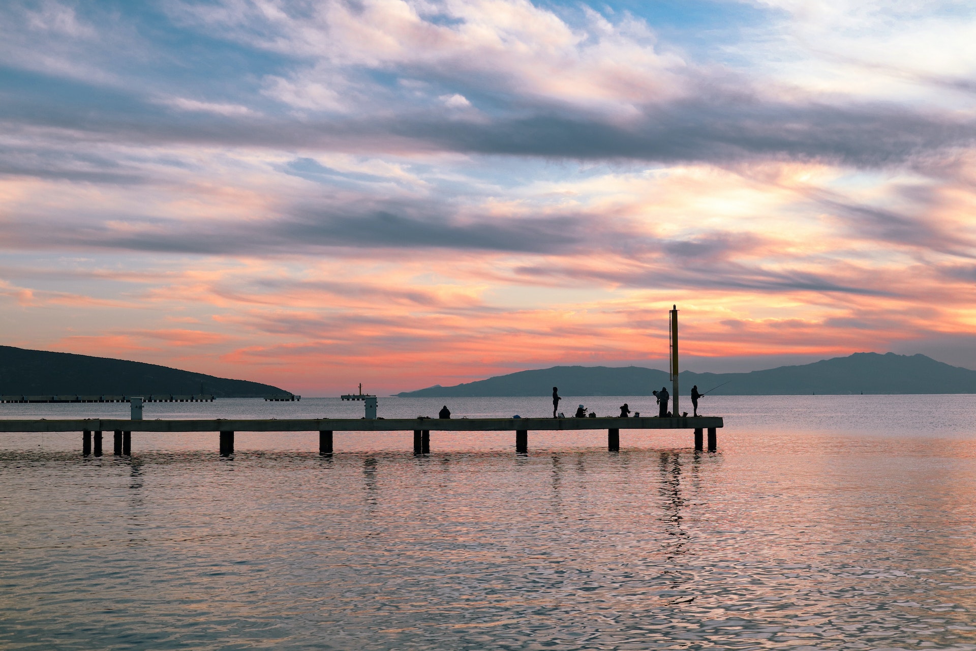 image of people standing on a pier.