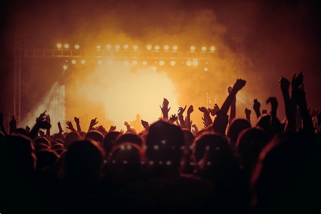 crowd of people at a music event on beach