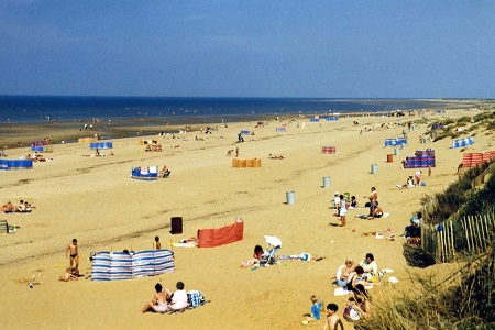 crowd on a beach, on a sunny day