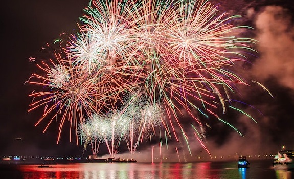 fireworks over a river