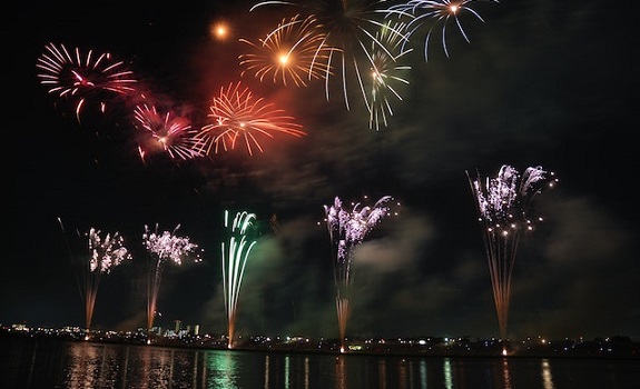 fireworks over a river