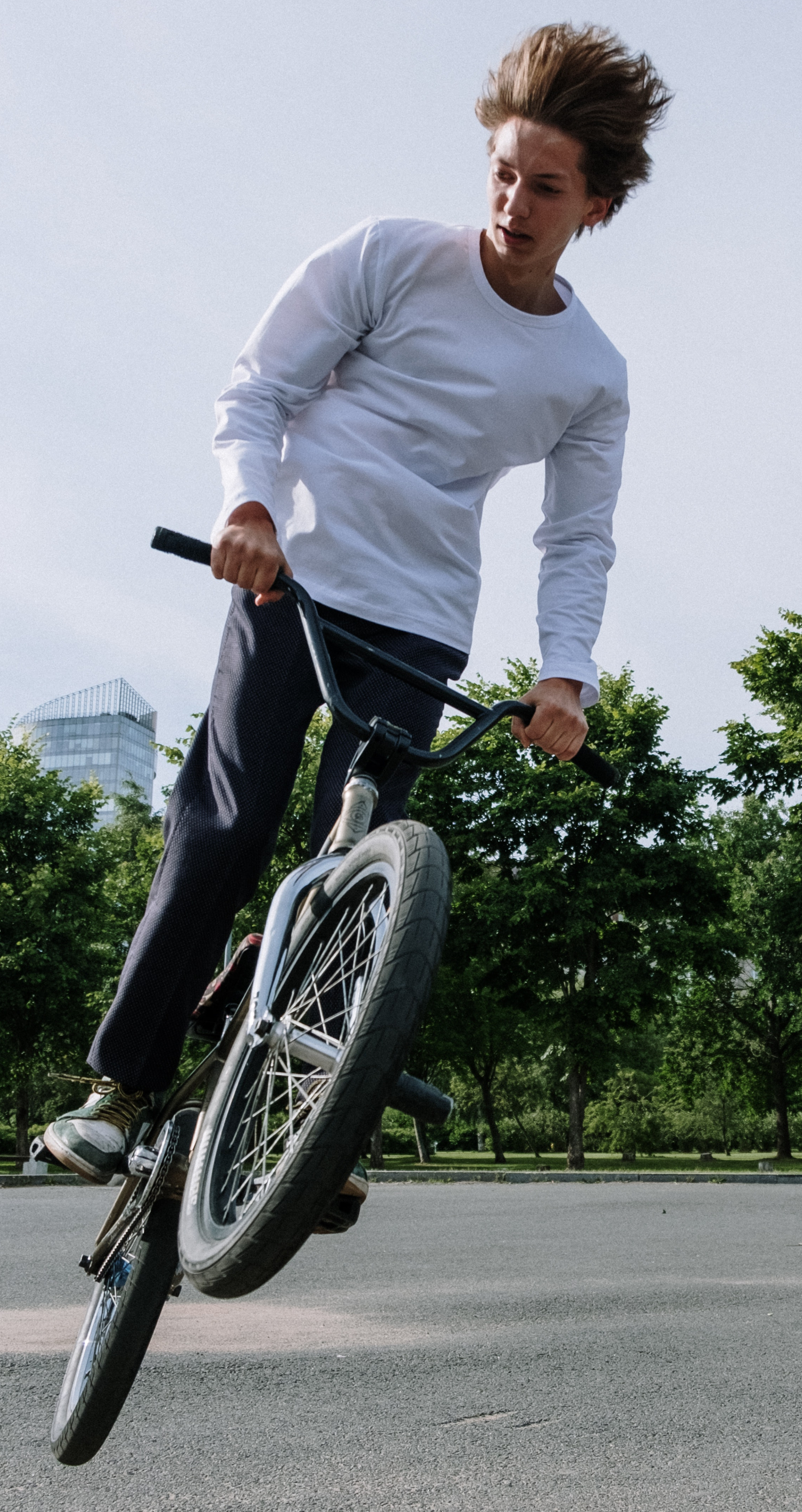 boy doing stunt on a bike