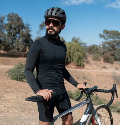 Man with a bike wearing a protective helmet