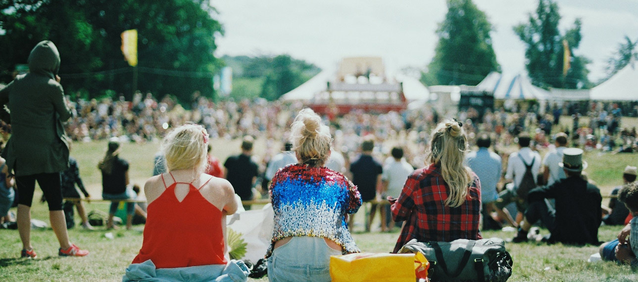 A crowd of people at an outdoor concert