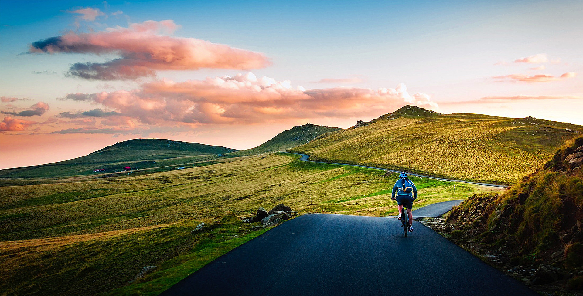 rear view of man on mountain road against the sky