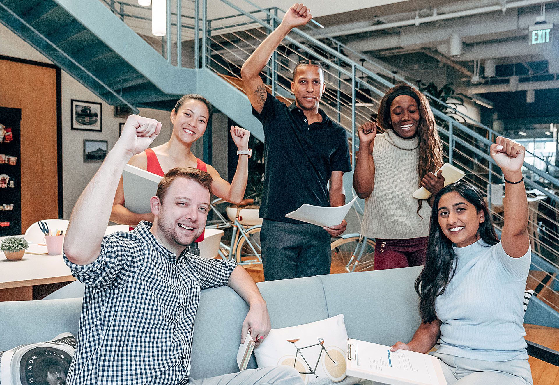 5 group of people putting up their fist
